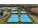 Four well-maintained tennis courts in a community setting at 19148 Dove Creek Dr, Tampa, FL 33647