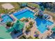 Community pool area with lap pool, leisure pool, and water slide at 19148 Dove Creek Dr, Tampa, FL 33647