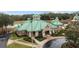 Community clubhouse with green roof and landscaping at 19148 Dove Creek Dr, Tampa, FL 33647