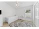 Cozy bedroom with a twin bed and a window with blinds at 19148 Dove Creek Dr, Tampa, FL 33647