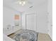 Spacious bedroom with double doors and a ceiling fan at 19148 Dove Creek Dr, Tampa, FL 33647