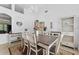 Formal dining room with a rustic table and decorative chandelier at 19148 Dove Creek Dr, Tampa, FL 33647