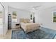 Spacious bedroom with a ceiling fan and large windows at 19148 Dove Creek Dr, Tampa, FL 33647