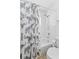 Bathroom with shower/tub combo and floral shower curtain at 19148 Dove Creek Dr, Tampa, FL 33647