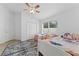 Bedroom with twin beds, ceiling fan and ample closet space at 19148 Dove Creek Dr, Tampa, FL 33647