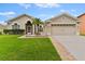 Attractive one-story home with a two-car garage and well-manicured lawn at 19148 Dove Creek Dr, Tampa, FL 33647
