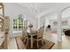 Open concept dining area with a view to the living room at 19148 Dove Creek Dr, Tampa, FL 33647