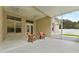 Spacious screened porch with seating and ceiling fans at 19148 Dove Creek Dr, Tampa, FL 33647
