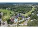 Aerial view of a community with golf course, pool, and clubhouse at 309 Fern Cliff Ave, Temple Terrace, FL 33617