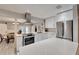 Modern kitchen with stainless steel appliances and white cabinets at 309 Fern Cliff Ave, Temple Terrace, FL 33617