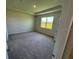 Bright bedroom showcasing neutral walls, plush carpeting, and tray ceiling for a cozy retreat at 18142 Beach Ranch Ter, Lakewood Ranch, FL 34211