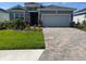 Beautiful single-Gathering home featuring a two-car garage and well-maintained landscaping at 18142 Beach Ranch Ter, Lakewood Ranch, FL 34211
