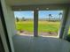 A covered patio offering an expansive view of the backyard, perfect for outdoor enjoyment at 18142 Beach Ranch Ter, Lakewood Ranch, FL 34211