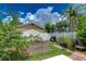 Backyard garden with raised beds and walkway at 3203 W San Luis St, Tampa, FL 33629