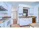 Bright kitchen with white cabinets, butcher block countertops, stainless steel appliances, and a window over the sink at 3203 W San Luis St, Tampa, FL 33629