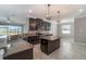 Spacious kitchen with dark cabinetry, granite countertops and an island at 10041 Celtic Ash Dr, Ruskin, FL 33573