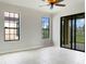 Bright living room with tile floors and access to a patio at 227 Mystic Falls Dr, Apollo Beach, FL 33572