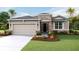 Two-story house with stone accents and attached garage at 18142 Beach Ranch Ter, Lakewood Ranch, FL 34211