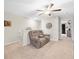 Spacious loft area with a ceiling fan and comfortable seating at 8491 Essington St, New Port Richey, FL 34654