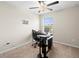 Home office with a computer desk and chair at 8491 Essington St, New Port Richey, FL 34654