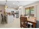 Kitchen with island, stainless steel appliances, and breakfast bar at 8491 Essington St, New Port Richey, FL 34654