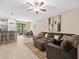 Spacious living room with sectional sofa and open floor plan at 8491 Essington St, New Port Richey, FL 34654