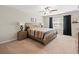 Spacious bedroom with large window and ceiling fan at 8491 Essington St, New Port Richey, FL 34654