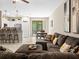 Open concept living room and kitchen with a sectional sofa at 8491 Essington St, New Port Richey, FL 34654