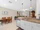 Eat-in kitchen with granite countertops and stainless steel appliances at 8491 Essington St, New Port Richey, FL 34654