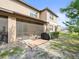 Private backyard with screened patio, grill, and small wooden deck at 8491 Essington St, New Port Richey, FL 34654