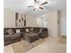 Living room featuring a sectional sofa and decorative pillows at 8491 Essington St, New Port Richey, FL 34654