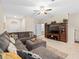 Open living area with sectional sofa and built-in entertainment center at 8491 Essington St, New Port Richey, FL 34654