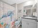 Bathroom with a turtle-themed shower curtain at 8491 Essington St, New Port Richey, FL 34654