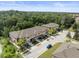 Aerial view of townhome community showcasing building exteriors and landscaping at 8491 Essington St, New Port Richey, FL 34654