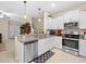 Updated kitchen with stainless steel appliances and granite countertops at 8491 Essington St, New Port Richey, FL 34654