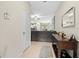 Bright and spacious entryway with views into the living room and kitchen at 8491 Essington St, New Port Richey, FL 34654
