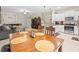 Dining area with a wood table and chairs adjacent to the kitchen at 8491 Essington St, New Port Richey, FL 34654