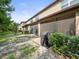 Community of townhomes with lush landscaping and private patios at 8491 Essington St, New Port Richey, FL 34654