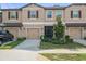Three townhouses with garages and landscaping at 8491 Essington St, New Port Richey, FL 34654
