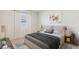 Bright bedroom with queen-size bed and neutral color palette at 16721 Harvester Ter, Lakewood Ranch, FL 34211