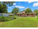 Brick home with a large backyard, perfect for outdoor enjoyment at 1213 E Frierson Ave, Tampa, FL 33603