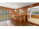 Charming wet bar with wooden cabinetry and tile flooring at 1213 E Frierson Ave, Tampa, FL 33603