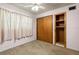 Bedroom with double door closet and built-in shelves at 1213 E Frierson Ave, Tampa, FL 33603