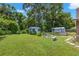 Large backyard with sheds and spacious grassy area at 1213 E Frierson Ave, Tampa, FL 33603