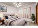 Bedroom with ceiling fan and large window at 1213 E Frierson Ave, Tampa, FL 33603