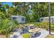 Relaxing patio area with stone table and benches at 1213 E Frierson Ave, Tampa, FL 33603
