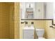 Retro bathroom with yellow tile and shower/tub combo at 1213 E Frierson Ave, Tampa, FL 33603