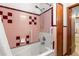 Bathroom with tub, shower, and grab bars at 1213 E Frierson Ave, Tampa, FL 33603