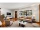 Bright living room featuring hardwood floors and neutral decor at 1213 E Frierson Ave, Tampa, FL 33603