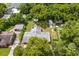 Property view showing house, detached garages, and large backyard at 1213 E Frierson Ave, Tampa, FL 33603
